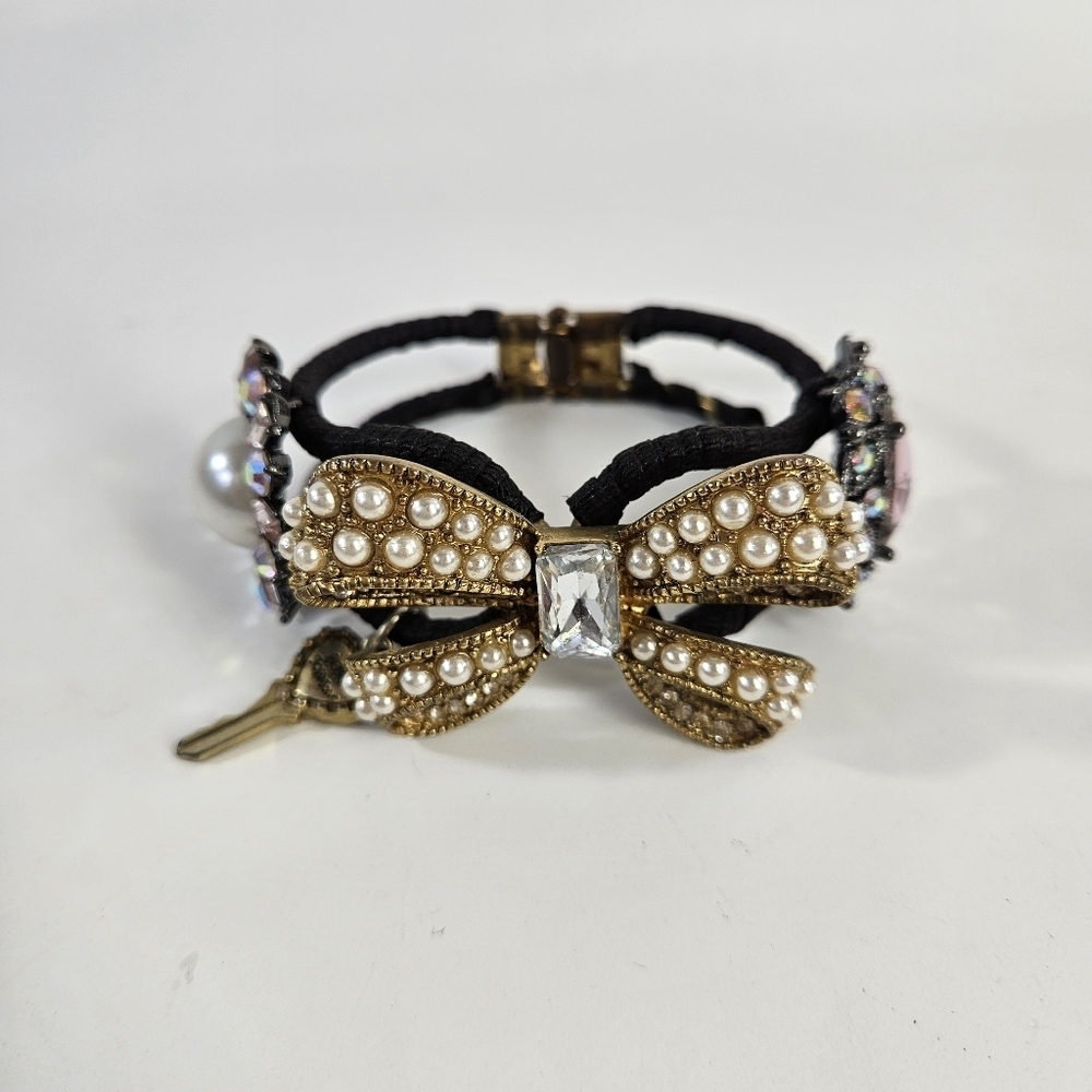 Betsey Johnson Black and Gold Bracelet with Intricate Detailing